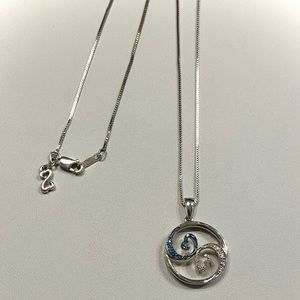 Jane Seymour “Open Hearts” pendant with blue sapphires